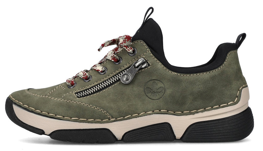 Olive-green sneaker with decorative side zipper and patterned laces.