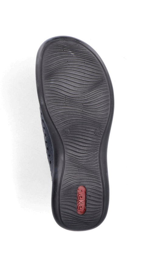 Black shoe sole with wavy grooves and red accent.