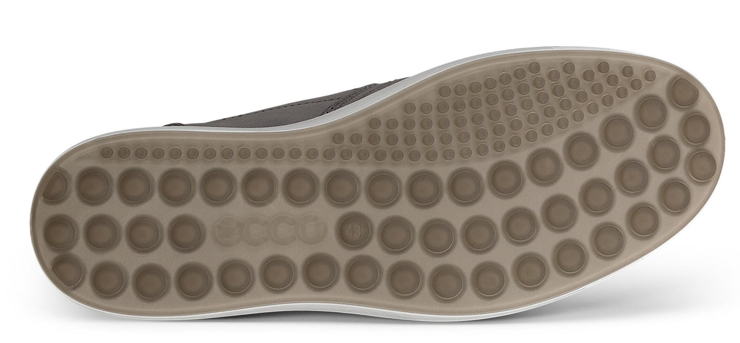 The sole of a shoe with many small circular protrusions.