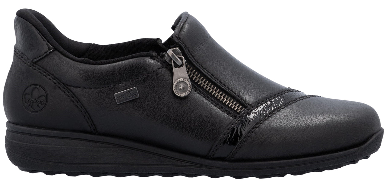 A black slip-on shoe with a zipper closure.