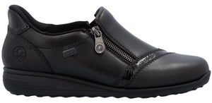 A black slip-on shoe with a zipper closure.