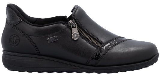 A black slip-on shoe with a zipper closure.