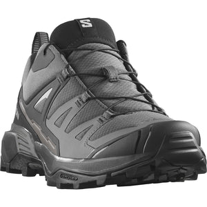 Gray hiking shoe with black laces and sole.