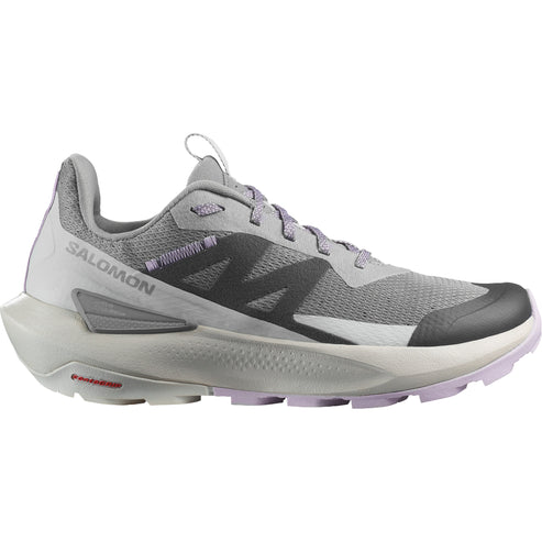 A grey running shoe with SALOMON printed on the side.