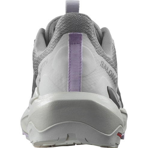 Rear view of a gray athletic shoe with a purple stripe.