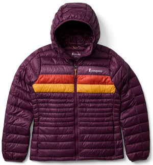 A plum-colored, hooded, down-filled puffer jacket with a full-zip front and horizontal quilting. A wide orange and yellow striped band crosses the chest, and the Cotopaxi logo is visible on the upper left chest.