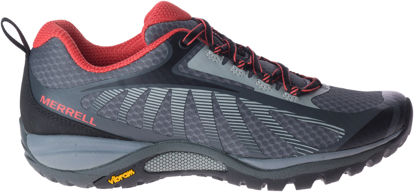 A sneaker with gray mesh, red accents, and a Vibram sole.