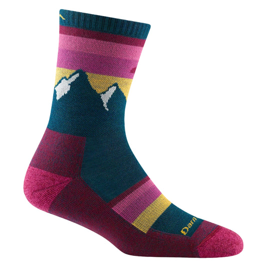 A sock with horizontal stripes in different shades of pink, yellow, and green. The middle of the sock has a mountain illustration.