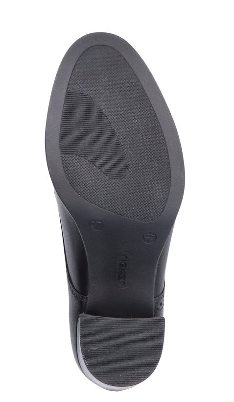Sole of black shoe with treaded heel.