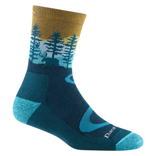 A sock with a landscape design featuring trees and a deer.