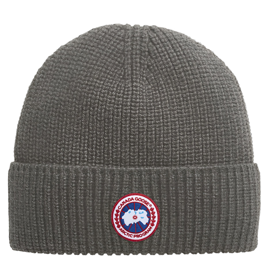Gray knitted beanie with a circular patch with a polar bear and text "ARCTIC PROGRAM".