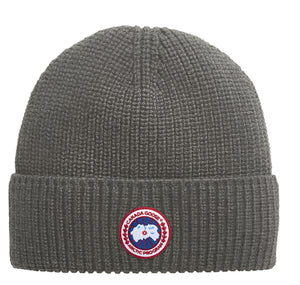 Gray knitted beanie with a circular patch with a polar bear and text "ARCTIC PROGRAM".