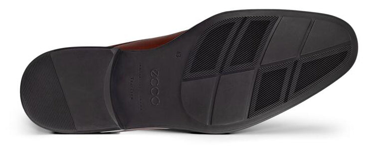 Bottom view of a dress shoe showing its black rubber sole.