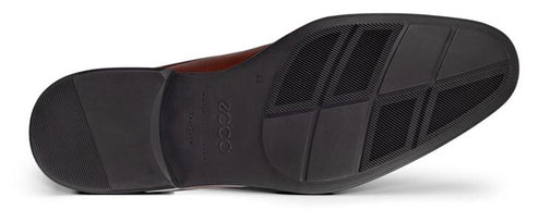 Bottom view of a dress shoe showing its black rubber sole.