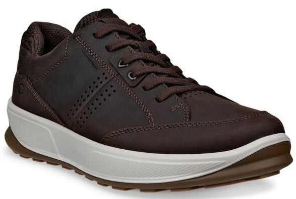 Brown leather shoe with white midsole and brown outsole, lace-up closure, and a perforated design along the sides.