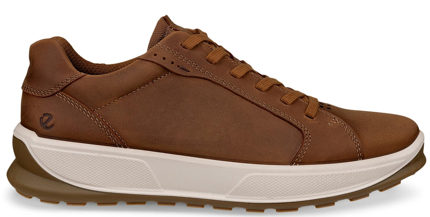 Brown leather low-top sneaker with white sole and brown tread.