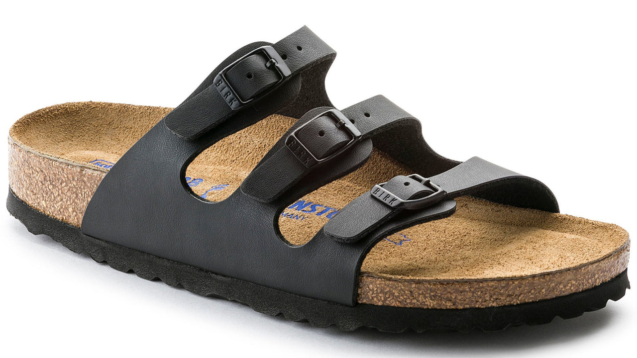Black sandal with three adjustable straps and a cork sole.