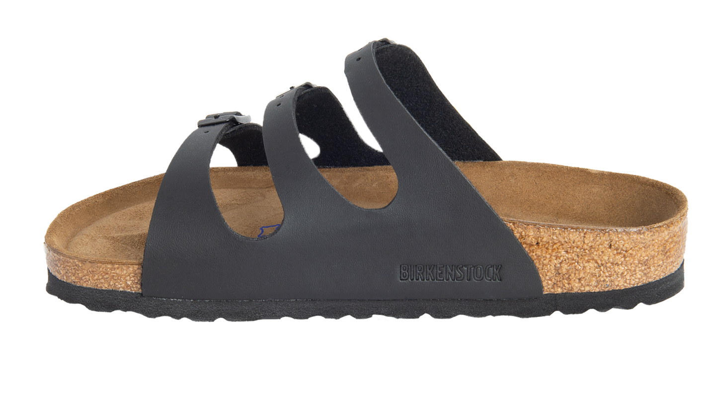 Black sandal with three straps and buckle.