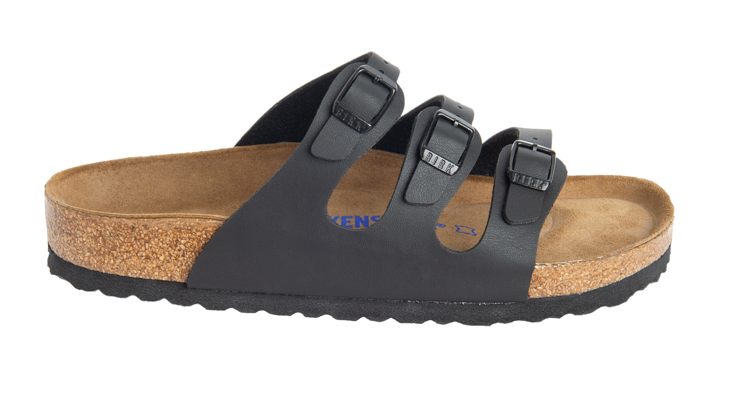 Black sandal with three straps and adjustable buckles.