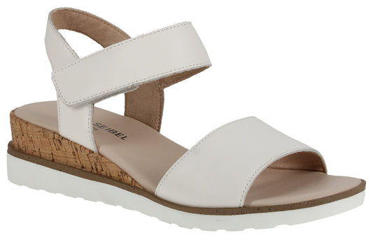 White sandal with adjustable velcro strap and wedge heel.