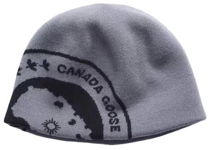 A gray knit beanie with a partial black graphic featuring the text 'CANADA GOOSE' and a circular icon.