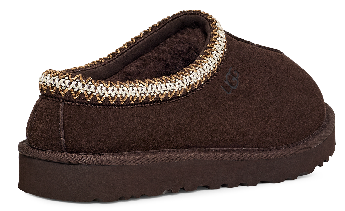 Brown slipper with decorative stitching around the opening.