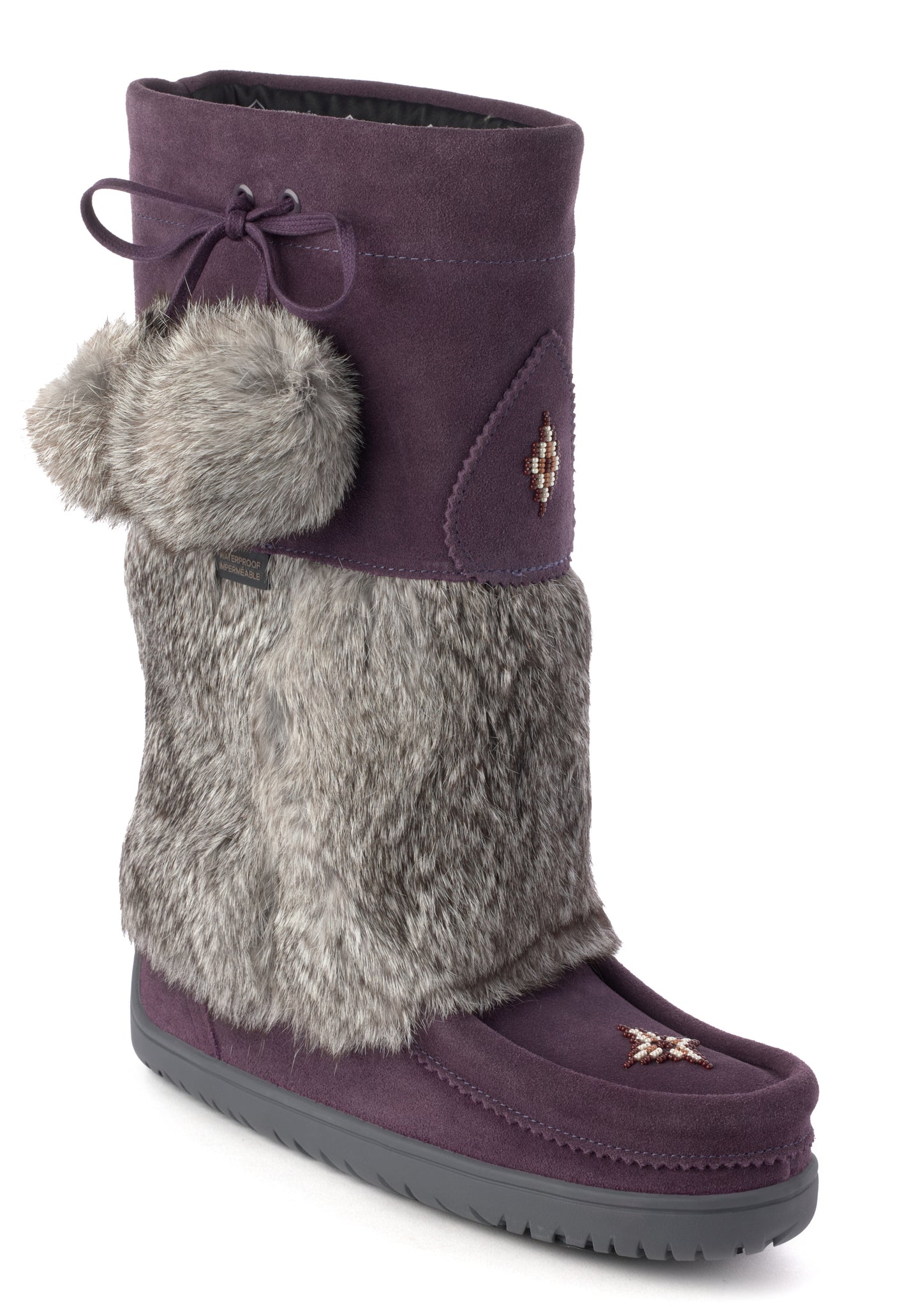Knee-high purple suede boot with faux fur, pom poms, and a moccasin toe.