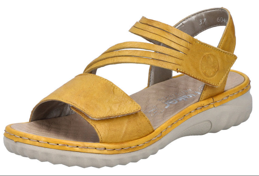 A yellow sandal with multiple straps and velcro closures.