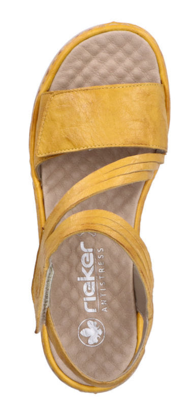 A yellow rieker sandal with multiple straps.