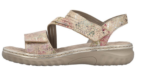 Beige sandal with a flower pattern and hook and loop straps.