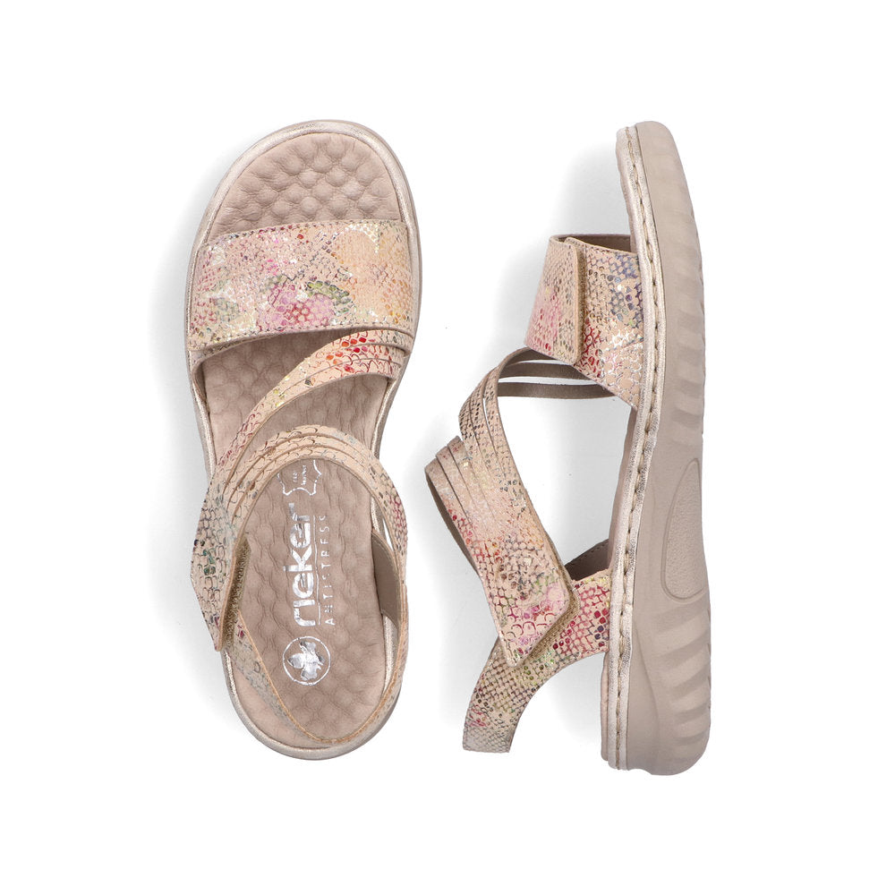 Two beige and pink patterned sandals. One sandal is upright showing the inside and the top of the sandal, the other sandal is on its side.
