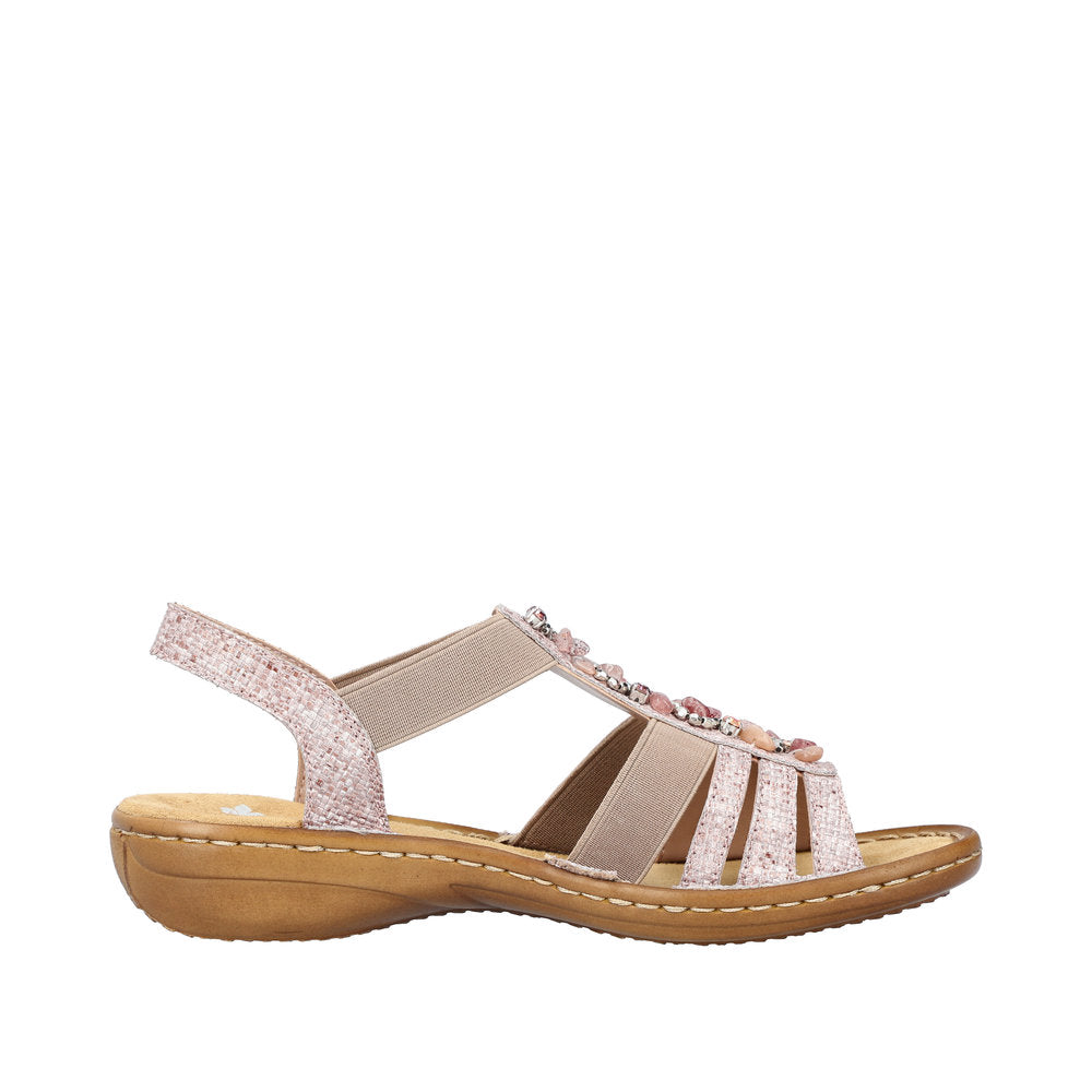 Side view of a light pink sandal with multiple straps and gemstone embellishments.