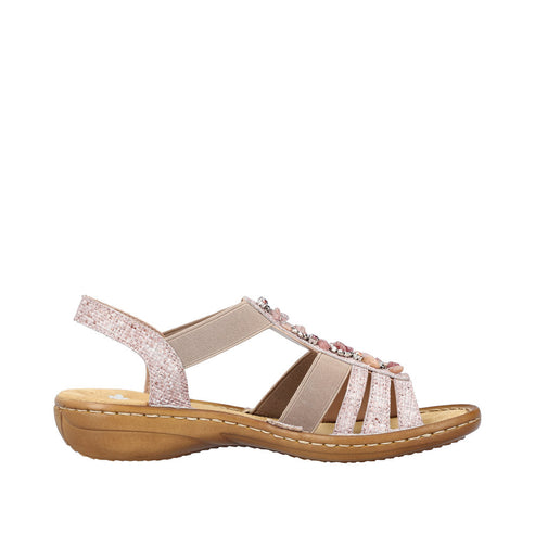 Side view of a light pink sandal with multiple straps and gemstone embellishments.