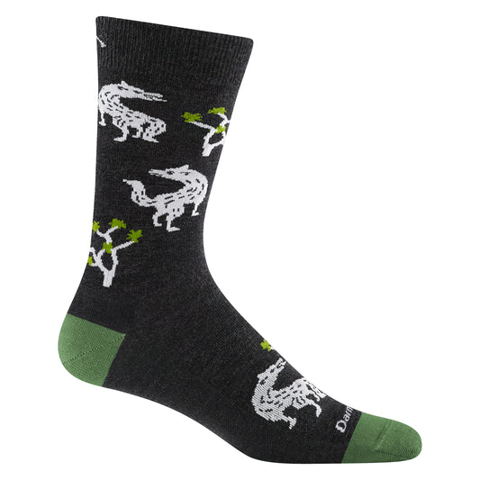 Dark gray sock with green toe and heel, decorated with white drawings of armadillos and Joshua trees.