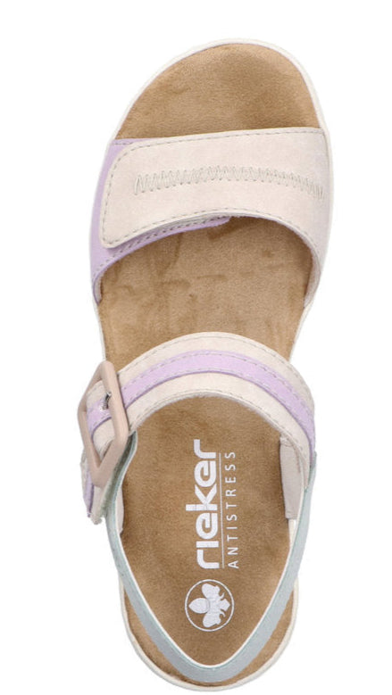 Top view of white and lavender sandal with visible buckle and rieker antistress logo.