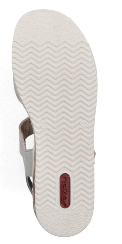 Beige sandal bottom with white chevron patterned outsole and a red oval logo.