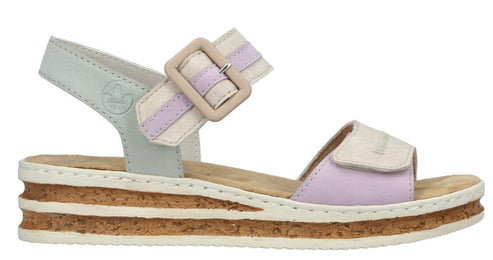 A platform sandal with lavender and cream-colored straps with an adjustable ankle strap and buckle, and a cork-like midsole.