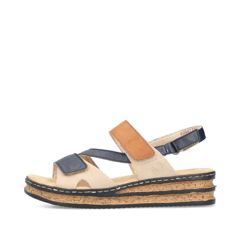 Side view of a platform sandal with light tan, navy, and tan straps. The platform is cork with a black rim.