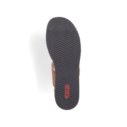 The bottom of a brown sandal with a dark-colored sole that has a ridged pattern.