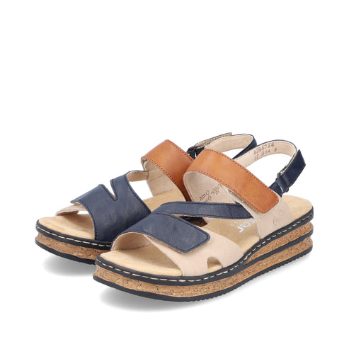 A pair of sandals, one with blue upper straps, and the other with a tan strap, on a tan sole and black trim.
