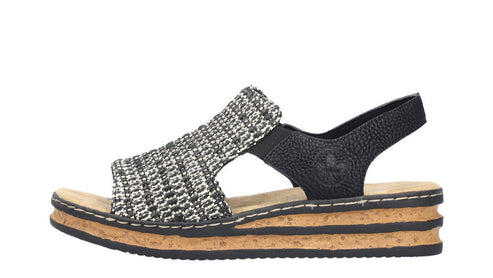 Women's platform sandal with woven-style black and white strap and black ankle strap.