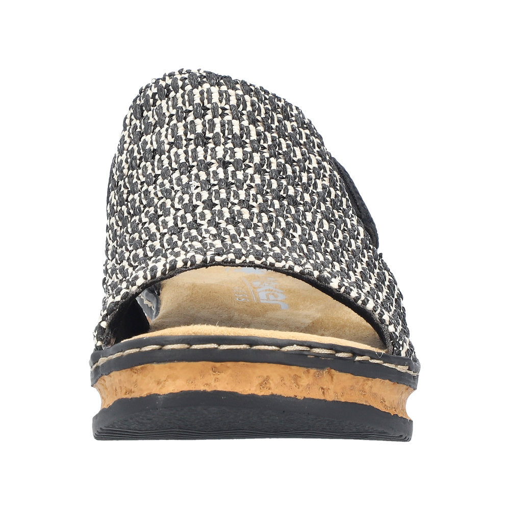 Front view of a woven, black and white, platform sandal with a cork midsole.