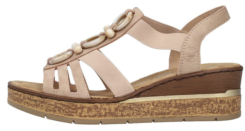 Beige sandal with decorative beige ring-shaped beads and a wedge heel.
