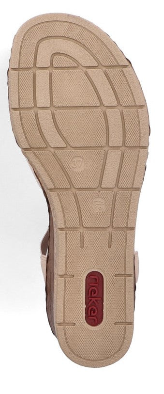 A brown sandal sole with a red oval logo and a patterned surface.