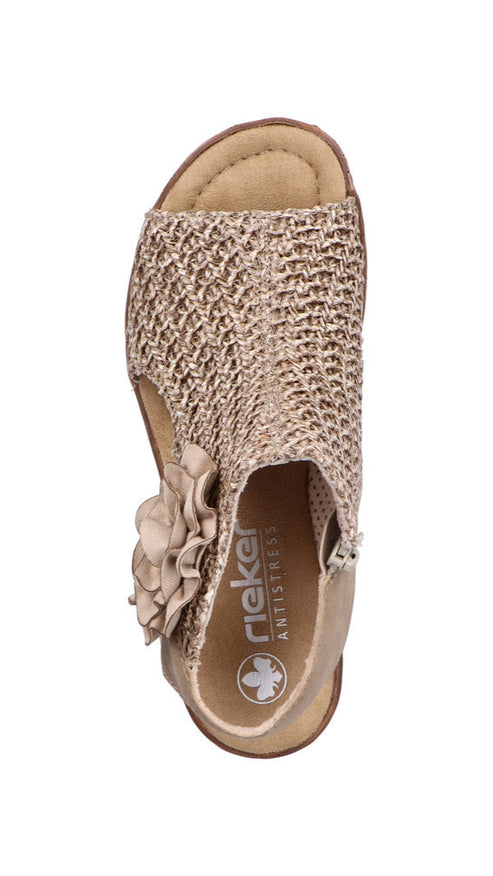 Beige sandal with flower detail and visible brand logo.