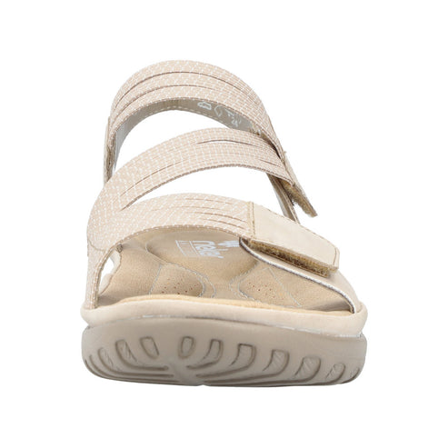 Beige sandal with textured straps and adjustable velcro closure.