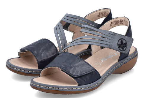 Pair of dark and light gray open toe sandals with decorative stitching and multiple straps.