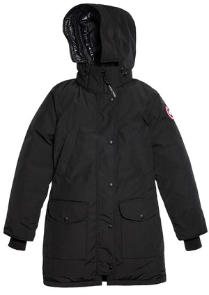 A black hooded winter parka featuring a front zipper with a snap-button placket, two large patch pockets with flaps, ribbed sleeve cuffs, and a circular emblem on the left upper sleeve.