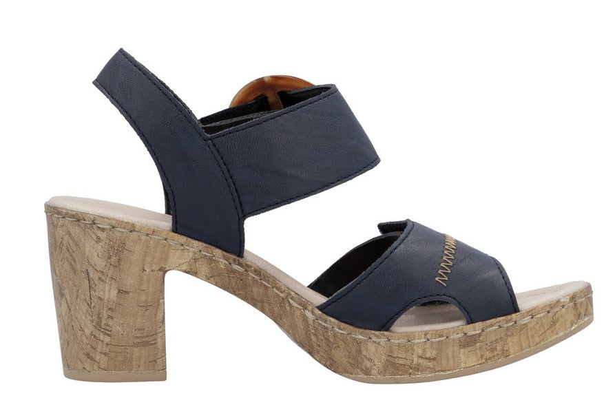 Navy sandal with thick cork heel and adjustable buckled ankle strap.
