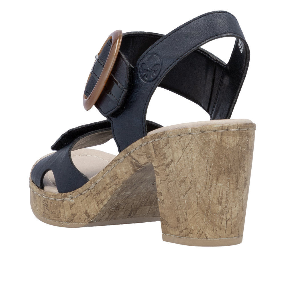 Navy sandal with cork block heel and brown buckle.